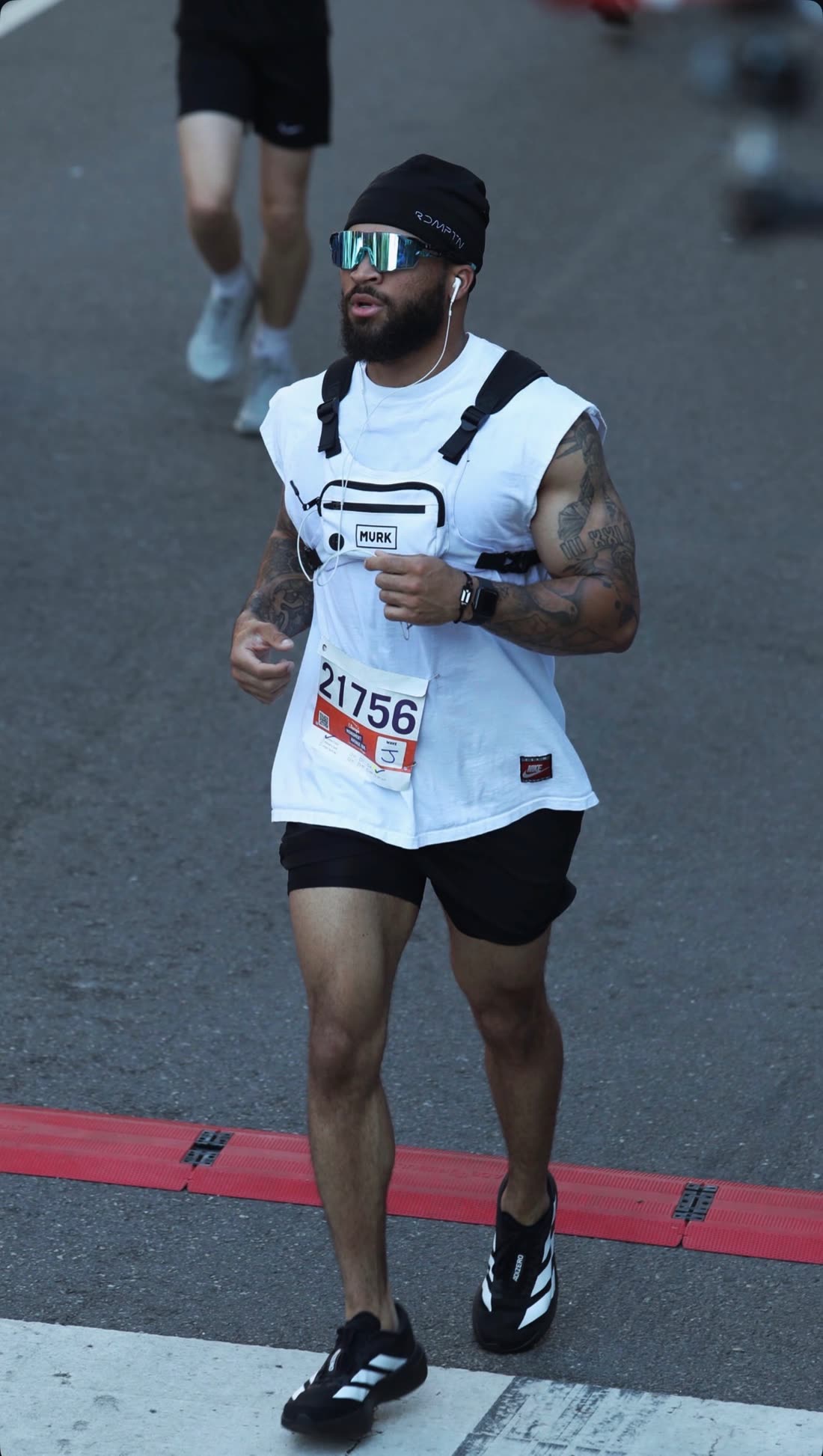 A member running a race, bib 21756